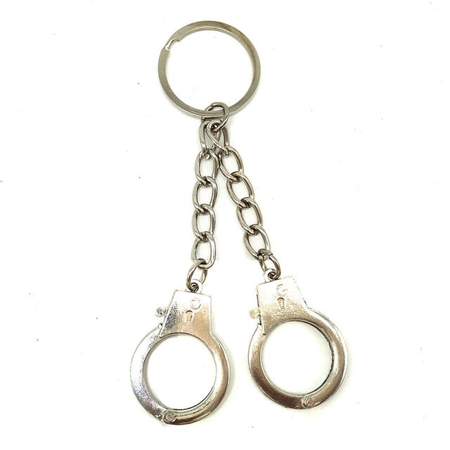 Handcuffs fashion accessory. Novelty size in various designs